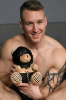 XR Brands Bondage Bear kolekcjonerski pluszak 23 cm pomarańczowy